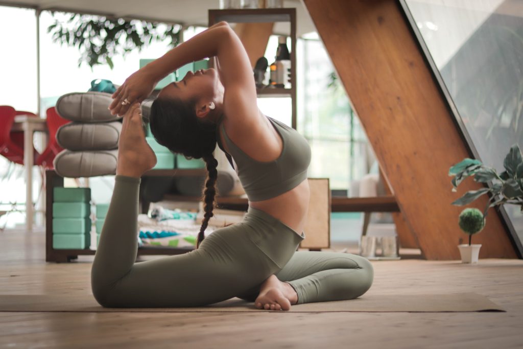 woman doing yoga and exercising